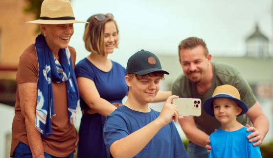 a family using a device together