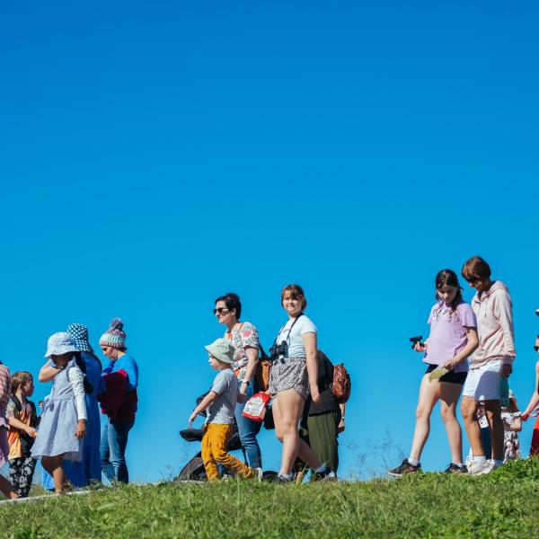 Group of people walking on a hill