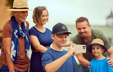 a family using a device together
