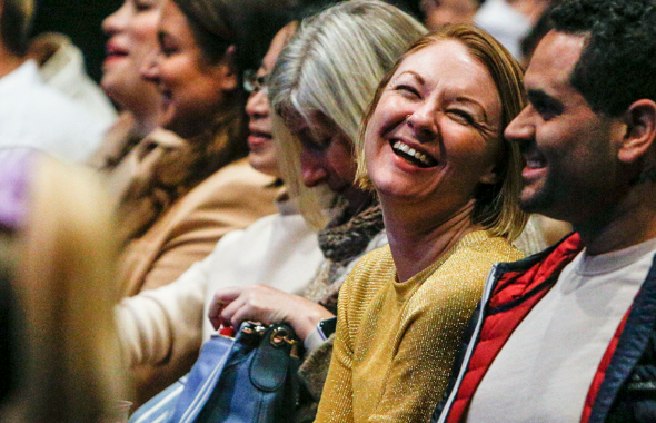 Women laughing in audience